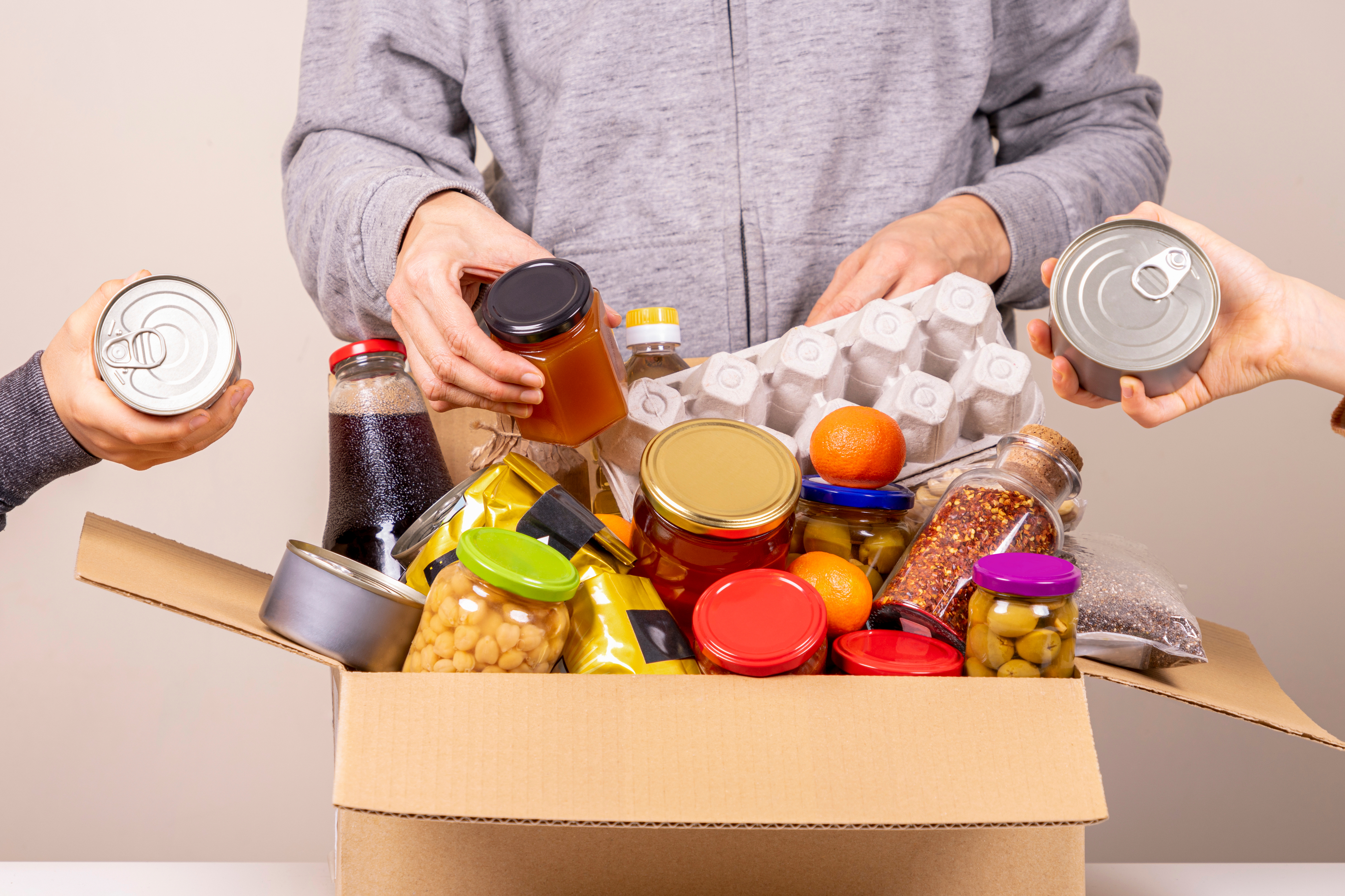 Volunteer packing food donations into bags